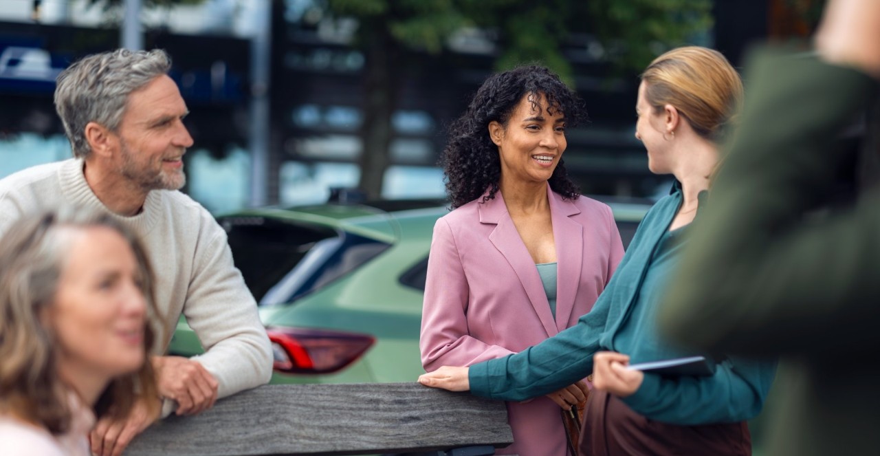 Group standing around a bench.